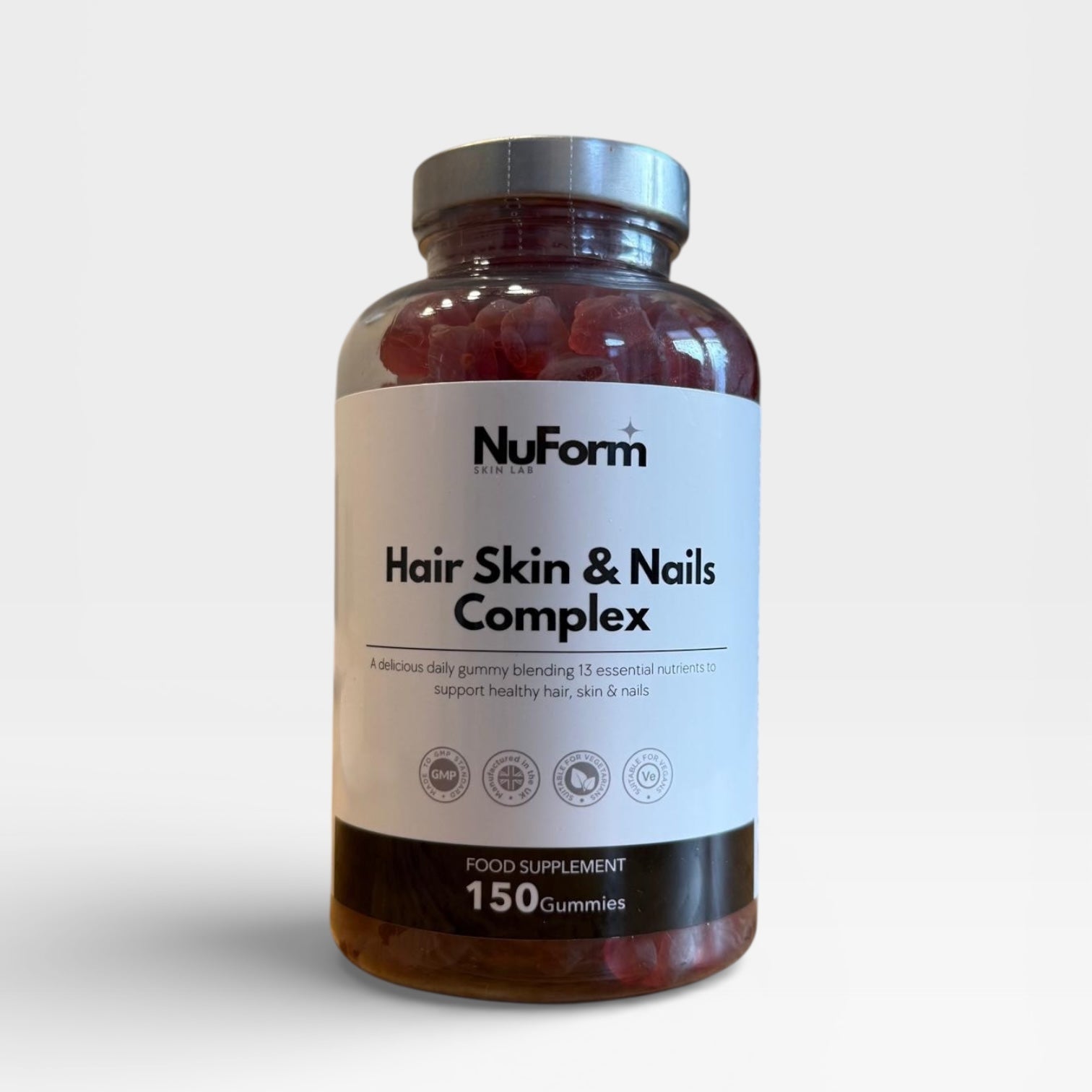 Bottle of NuFam Hair Skin & Nails Complex on a white background